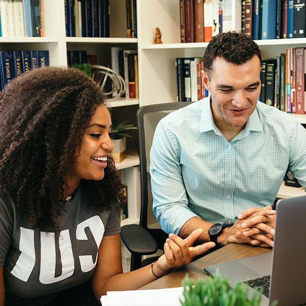 Female student speaking with a professor